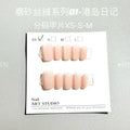 Set of frosted velvet false nails with Cat's Eye effect in short ladder sizes XS, S, and M on a clear background.
