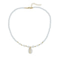 Close-up of a white conch shell bead necklace for women, showing the mother pearl shellfish pendant on a regular chain.