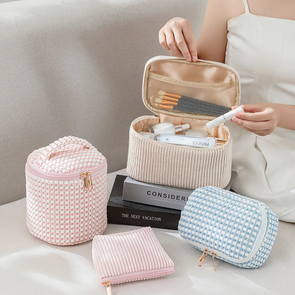 Four-piece polyester makeup bag set in cube style with modern simple design