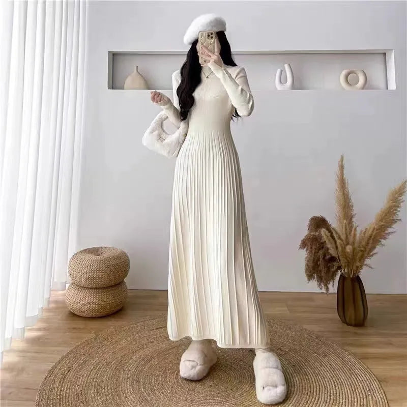 A women's solid colour A-line woollen skirt with a high waist, shown in a mid-length below-the-knee cut.
