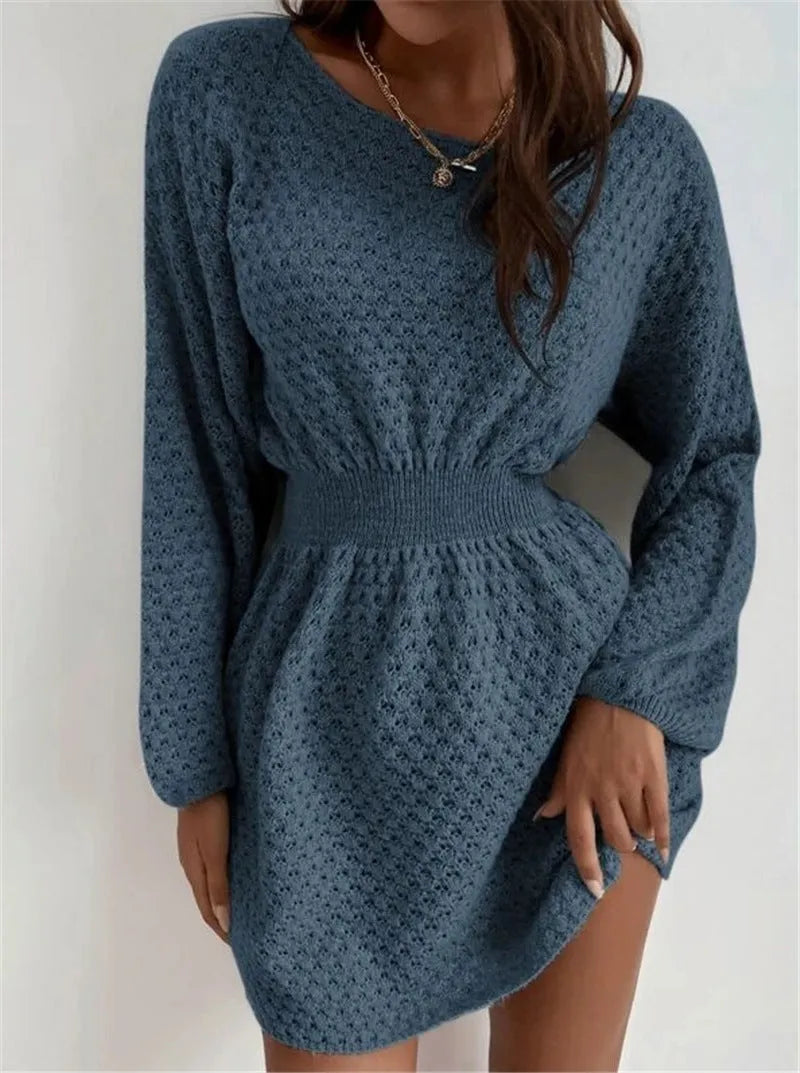 Blue women's knitted dress with crocheted flower detail and fitted waist