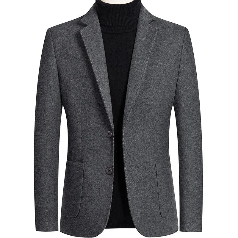 Men's slim fit wool suit jacket in grey on a hanger, showing notch lapel and button front.