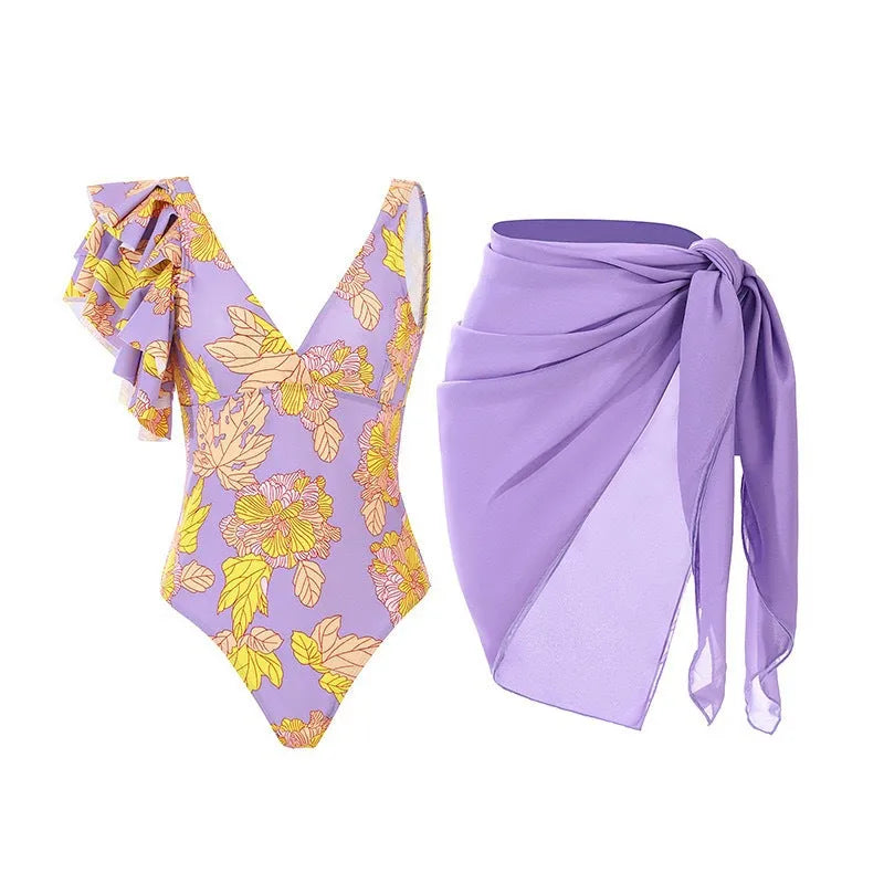 Women's solid colour one-piece swimsuit with spaghetti straps and a matching skirt.