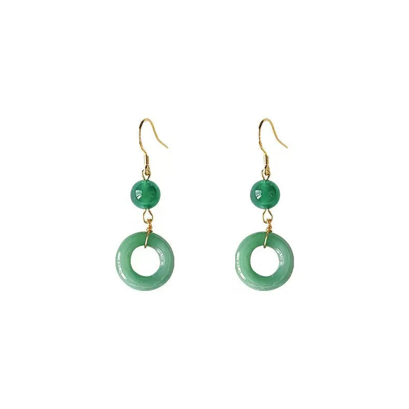 A pair of green and gold geometric earrings with a Chinese peace buckle and ring design.