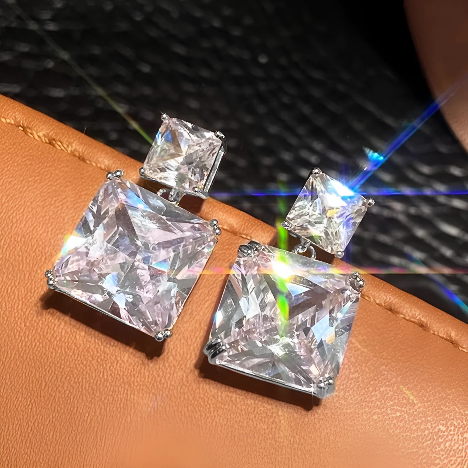 A pair of geometric square design copper earrings for women, shown in white gold and gold colour options.