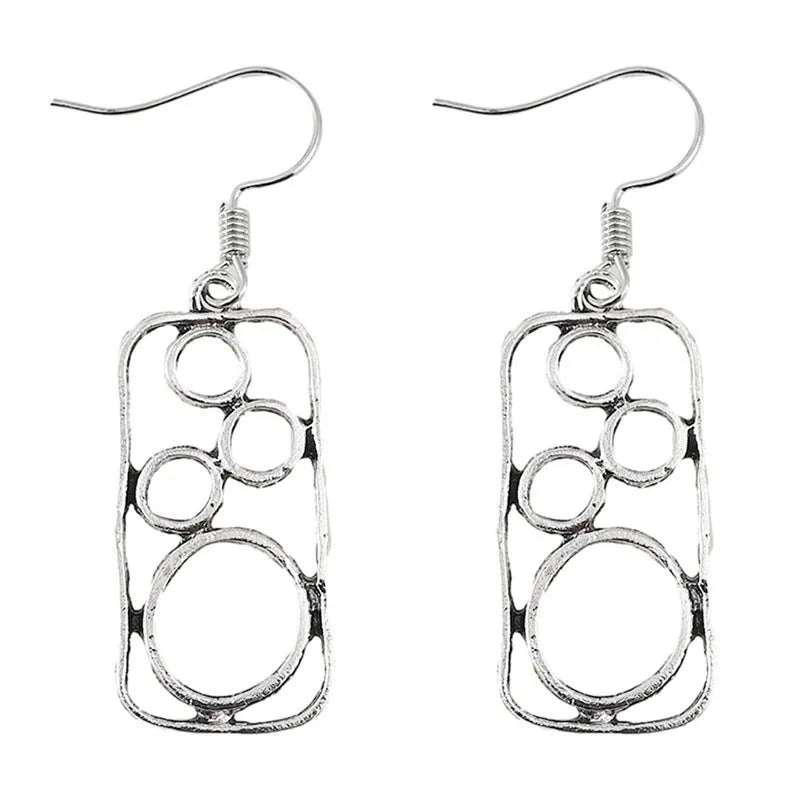 A pair of antique silver round ring earrings with a geometric irregular square design.