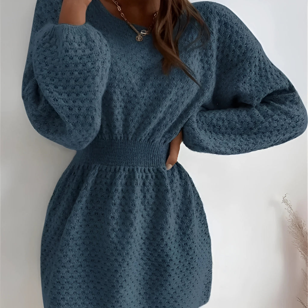 Blue women's knitted dress with crocheted flower detail and fitted waist