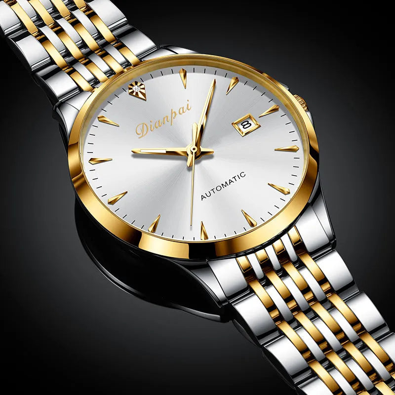 Men's simple dial automatic watch with stainless steel strap on a wrist.