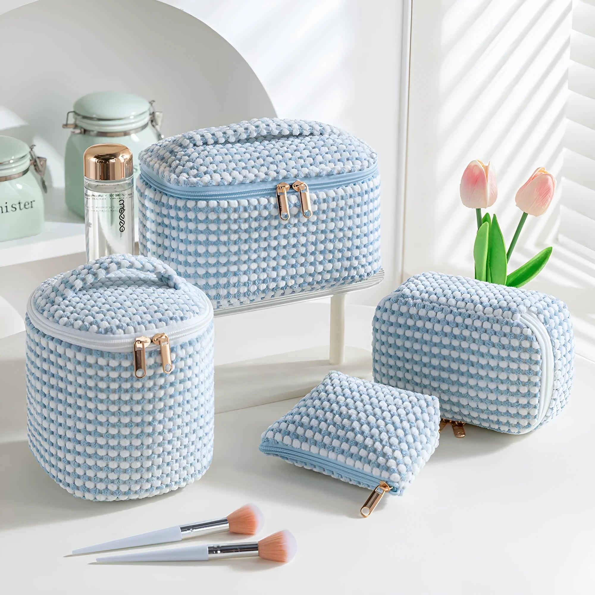 Four-piece polyester makeup bag set in cube style with modern simple design