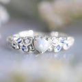 White electroplated alloy women's heart ring showing detailed heart shape design