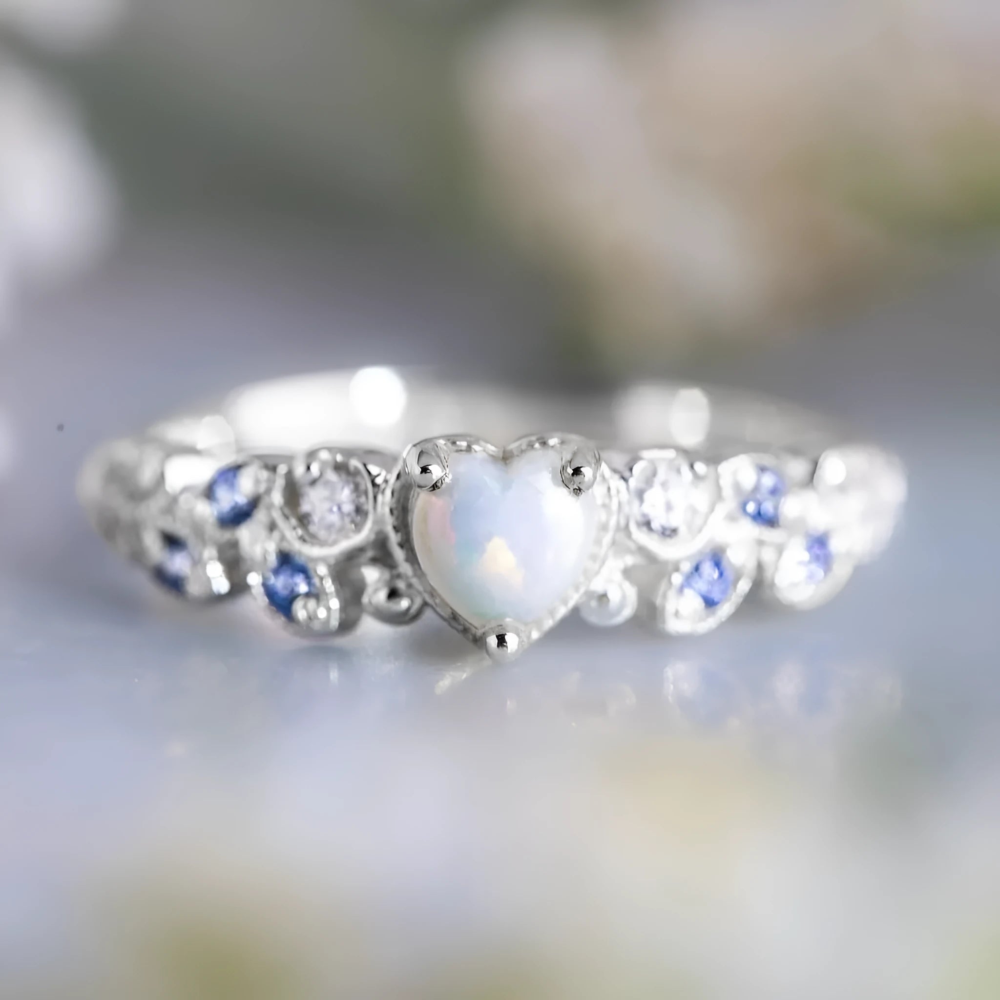 White electroplated alloy women's heart ring showing detailed heart shape design