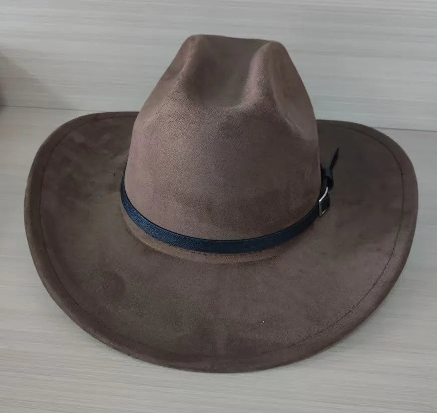 Brown leather velvet cowboy hat with a curved edge and conical crown on a plain background.