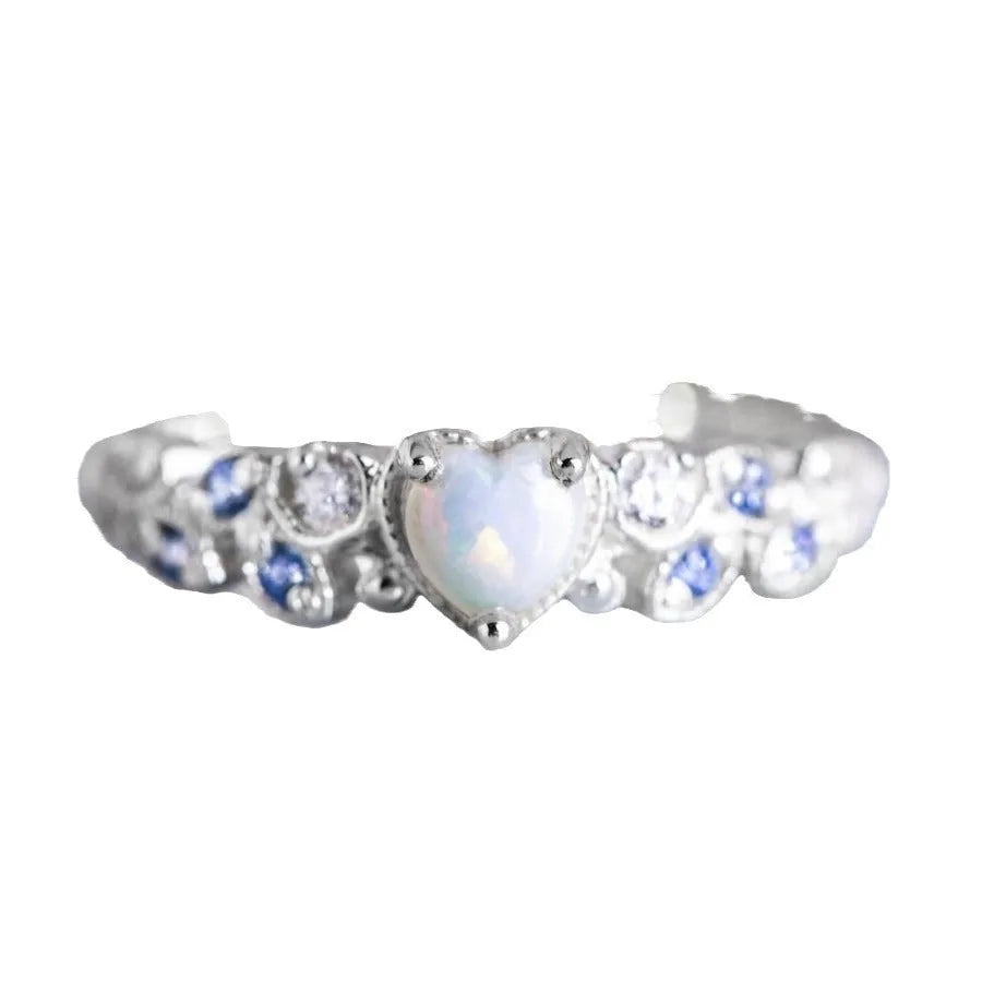 White electroplated alloy women's heart ring showing detailed heart shape design