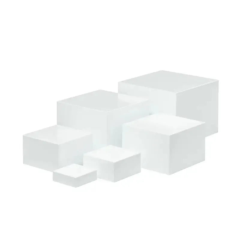 White plastic cube dessert display stand with six individual pieces for cake and confectionery presentation