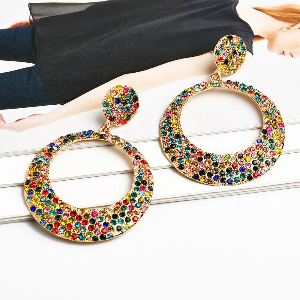 Colourful metal pendant earrings with diamond accents and cartoon style design