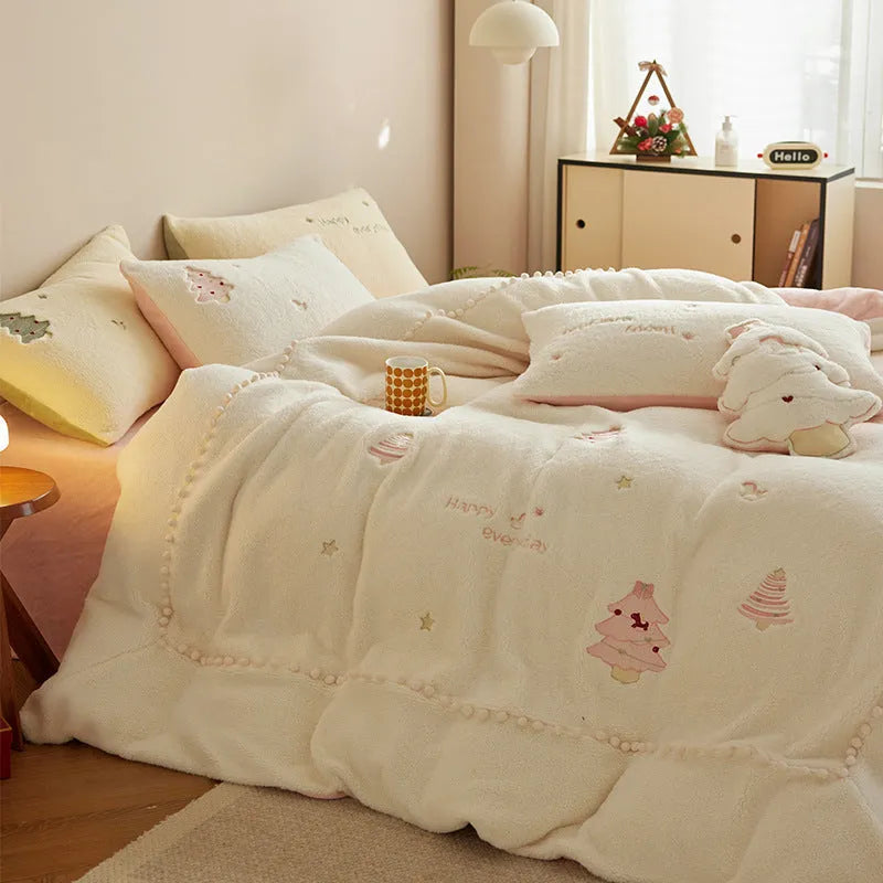 Milk fibre four-piece bed linen set with green Christmas tree pattern on a quilt cover and pillowcase.