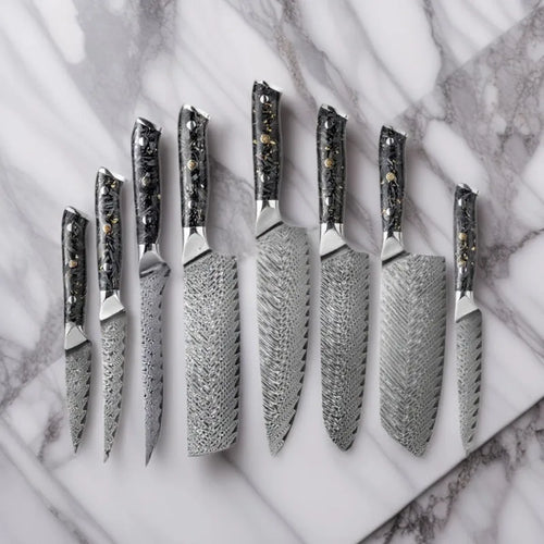Eight-piece Damascus steel kitchen knife set showing fishbone pattern and different blade sizes