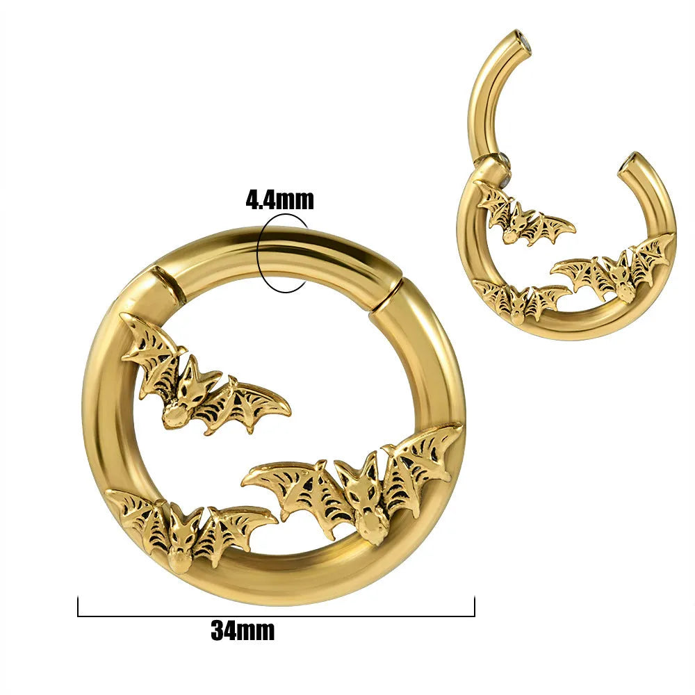 A pair of silver-toned fashion earrings with a geometric totem pattern design on a white background.