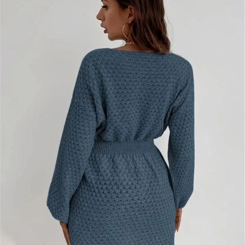 Blue women's knitted dress with crocheted flower detail and fitted waist