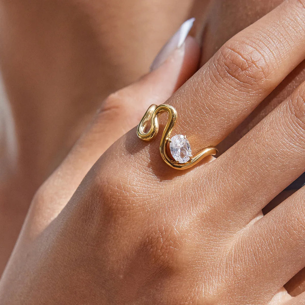 Geometric stainless steel zircon ring with no-fade finish on a hand.