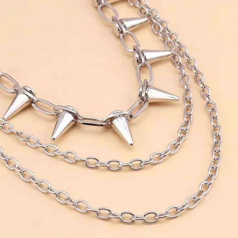 Silver metal double layer pants chain with rivet details and a zipper pendant ornament.