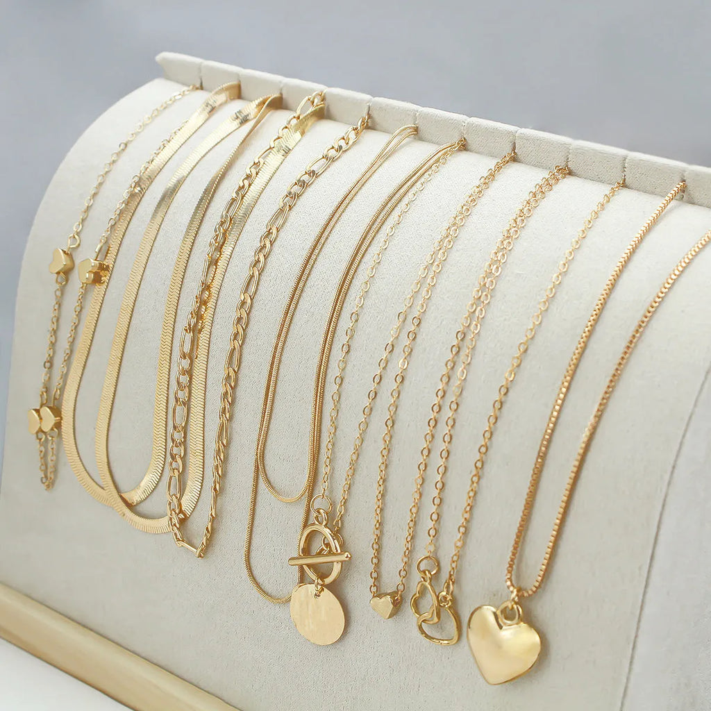10-piece gold electroplated women's necklace set with adjustable length and snake bone chain design