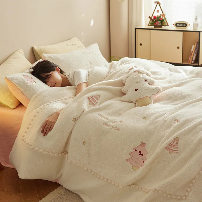 Milk fibre four-piece bed linen set with green Christmas tree pattern on a quilt cover and pillowcase.