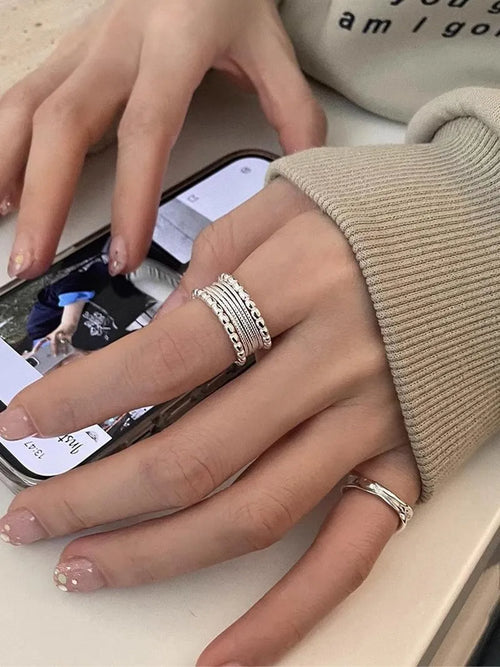 Copper alloy adjustable opening ring with woven twisted multilayer geometry design