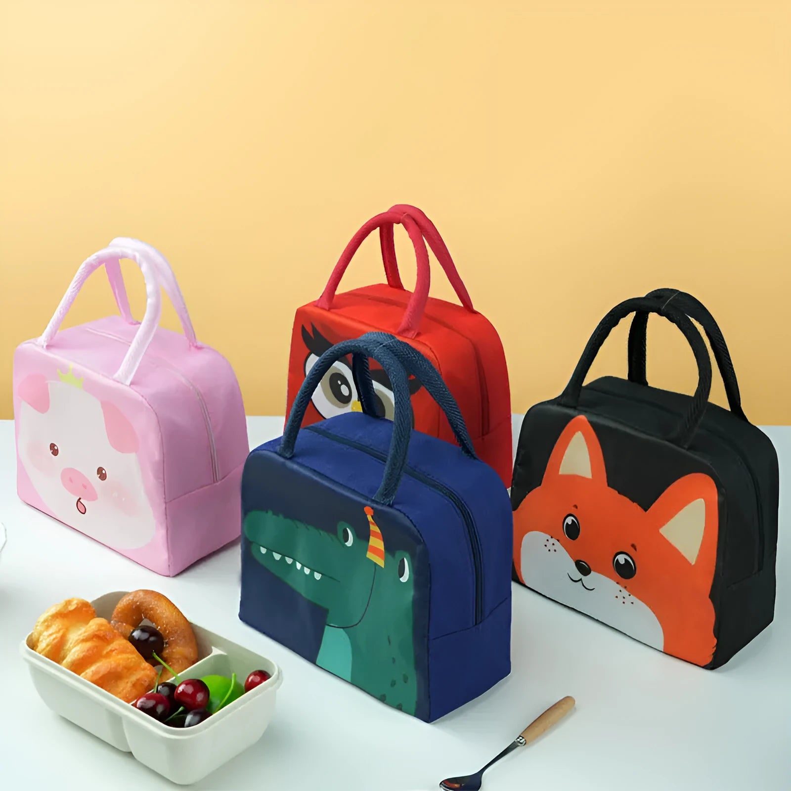 Children's insulated lunch bag with cartoon animal designs including orange bear and green dinosaur patterns