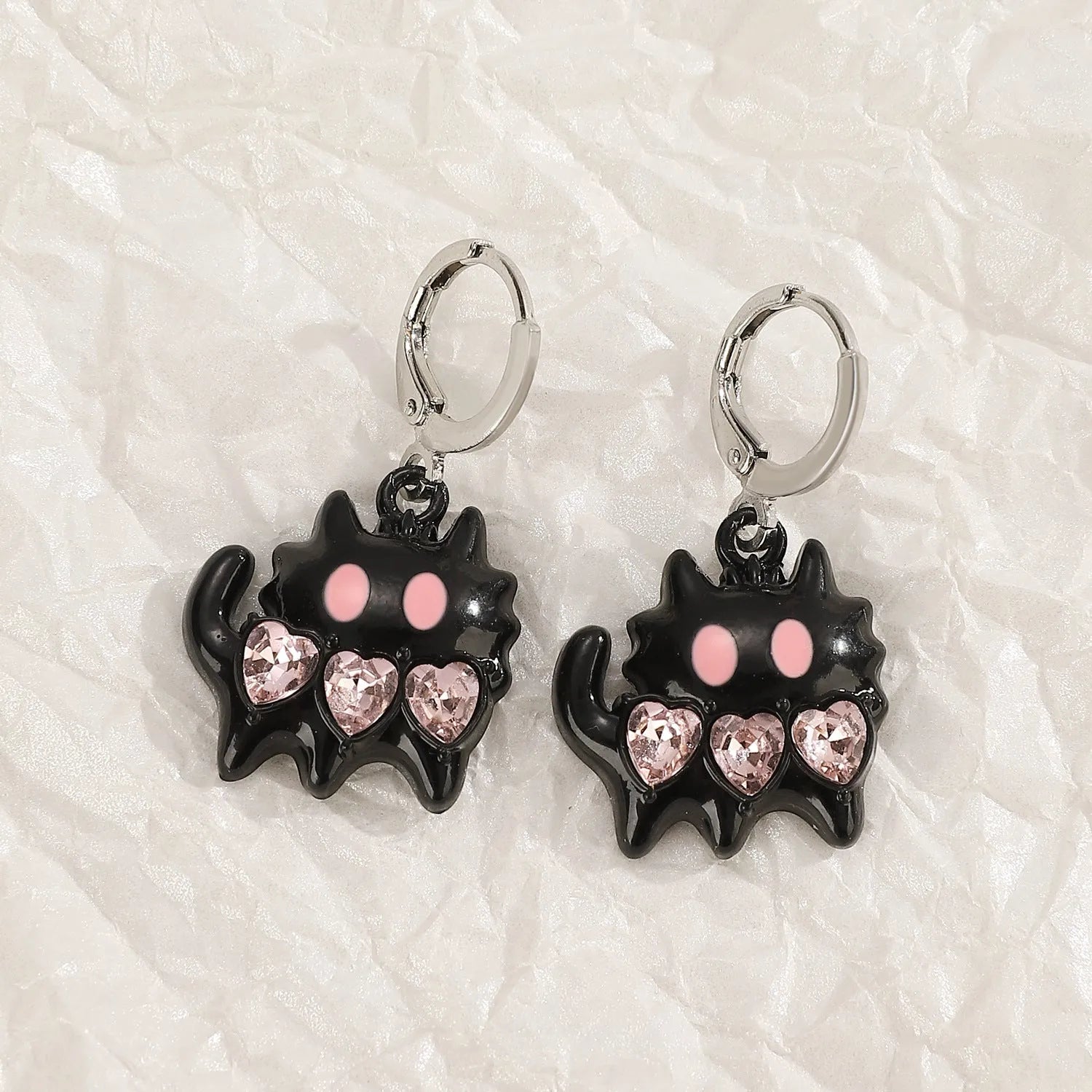 Women's alloy earrings with cross and heart designs in white and antique silver colour variants