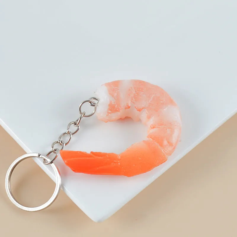 PVC injection moulded shrimp-shaped keychain with door buckle, 1.5cm thick.