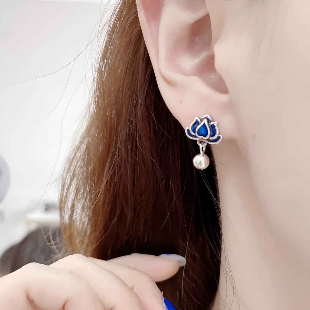 Blue Lotus alloy earrings with flower shape and lotus seedpod tassel detailing