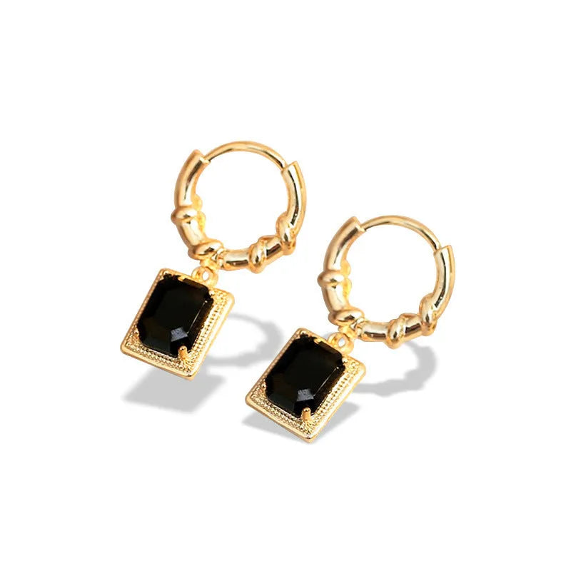 A pair of black geometric quadrilateral earrings with zircon accents on a copper base, retro French court style.