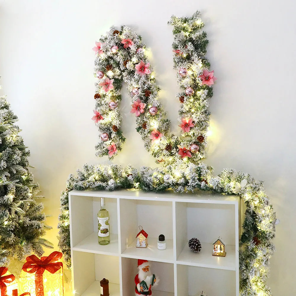 Christmas rattan garland decoration with flocked texture in five colour options displayed draped