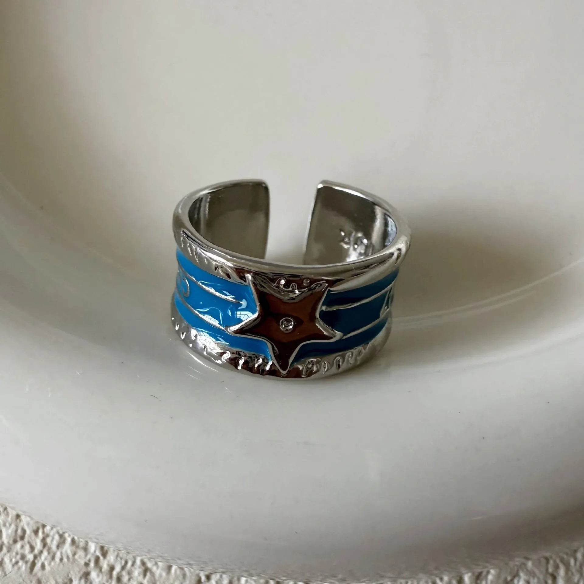 Geometric adjustable drop oil ring in copper with electroplated finish and linear detailing