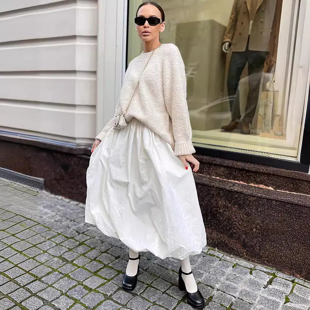 Women's cotton long skirt in solid white colour showing front view and length
