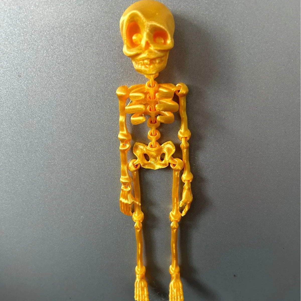 3D printed skull refrigerator magnet in various colours measuring 18cm tall
