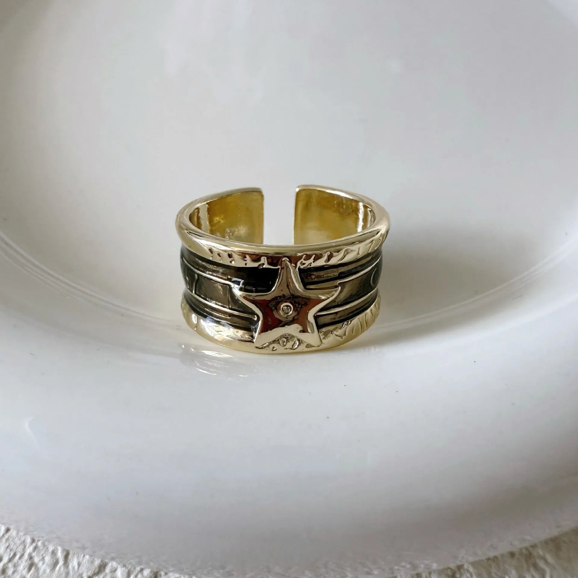 Geometric adjustable drop oil ring in copper with electroplated finish and linear detailing