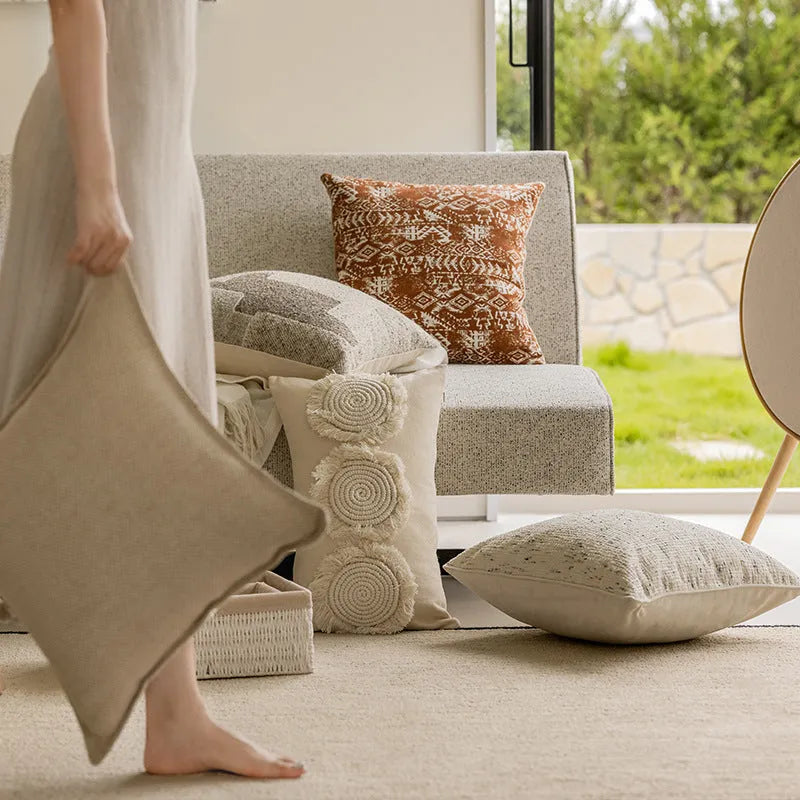 Solid colour sofa cushion pillow on a chair, showing 30x50cm and 45x45cm size options.