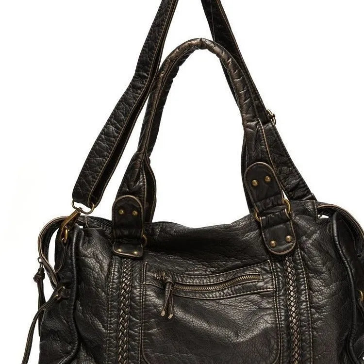 Women's retro motorcycle shoulder messenger bag in soft PU leather with woven design and internal organisation pockets