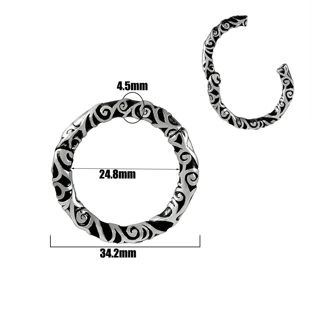 A pair of silver-toned fashion earrings with a geometric totem pattern design on a white background.