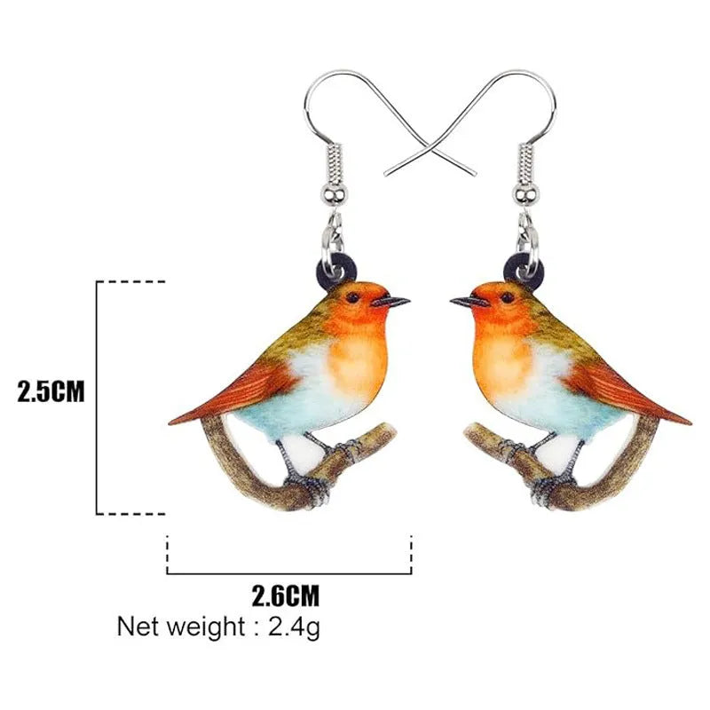 A pair of women's acrylic pendant earrings with a detailed Blue Titmouse bird design in a geometric style.