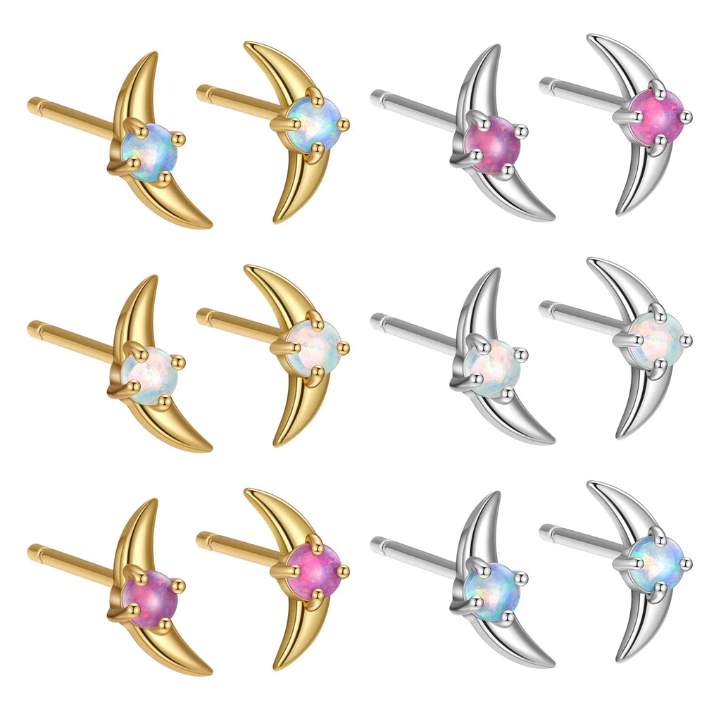 Geometric shaped 925 silver earrings with gold plating and a blue stone.