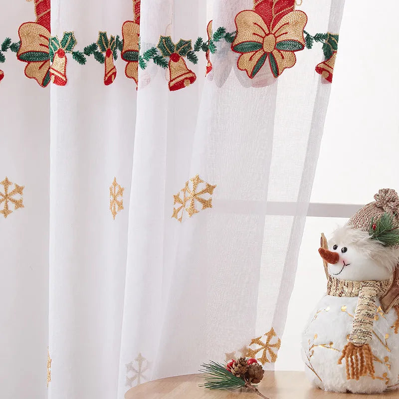 Pair of white Christmas curtains with red and green embroidered American-style snowflake design.