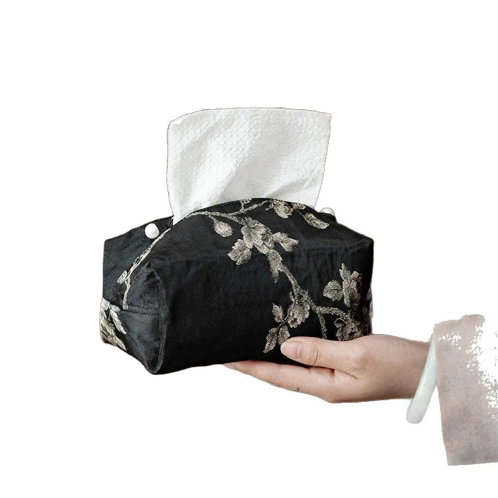 Chinese brocade fabric tissue box with embroidered white plum pattern, approximately 17 cm wide