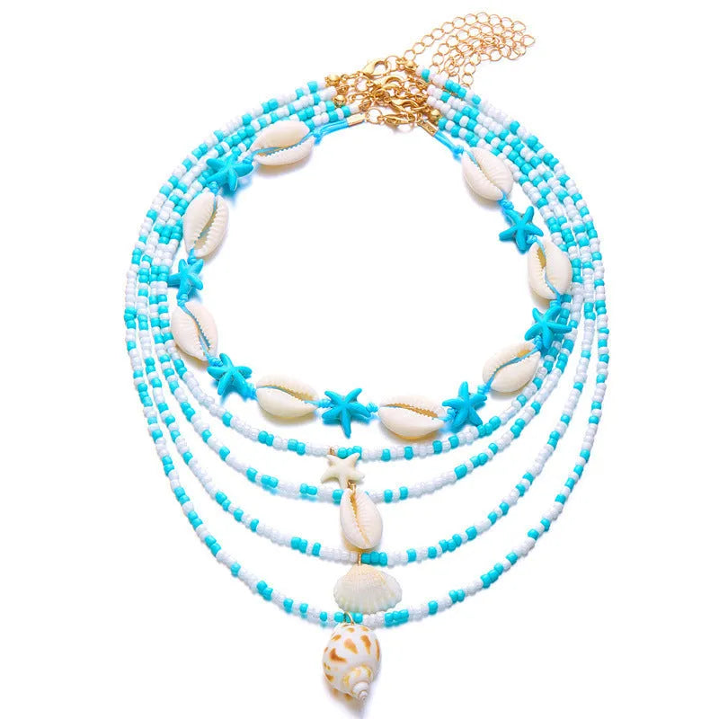 Women's five-layer shell and conch bead necklace set with adjustable chain on blue background