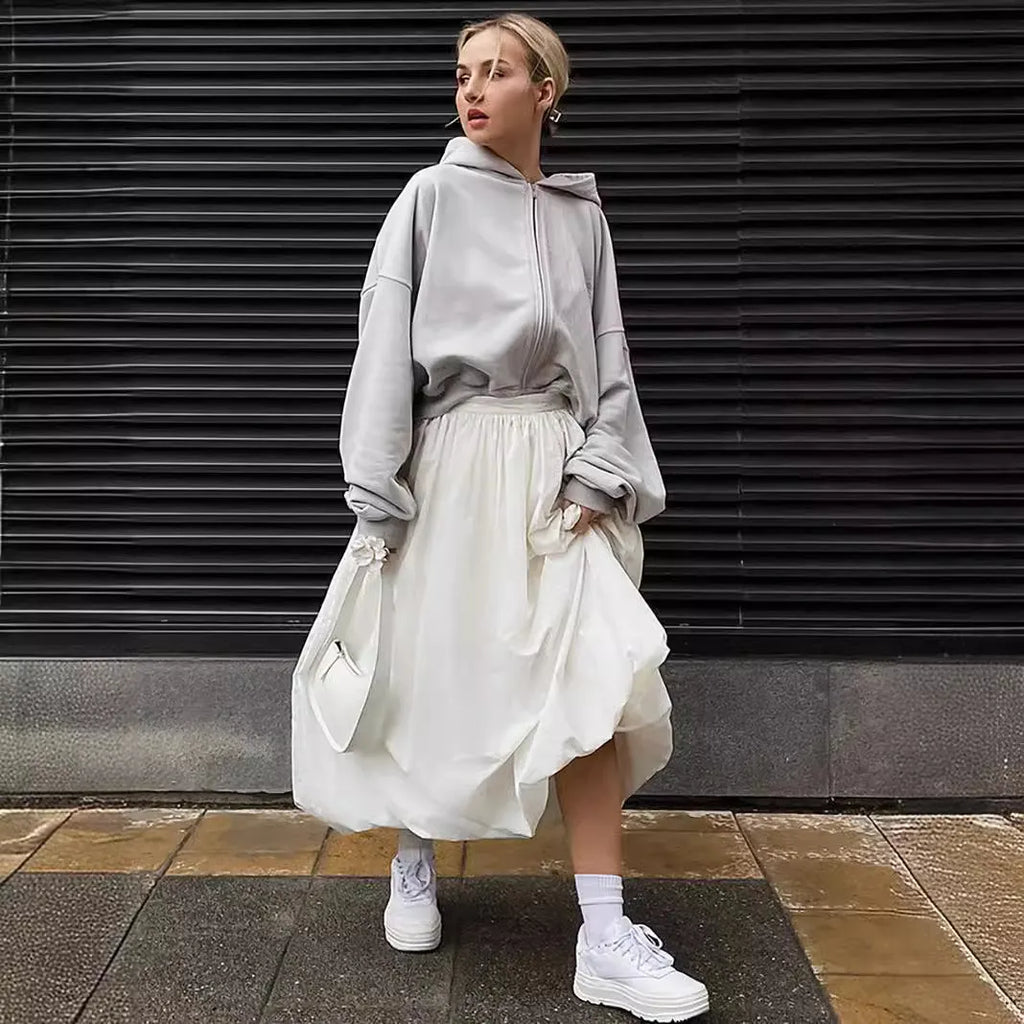 Women's cotton long skirt in solid white colour showing front view and length