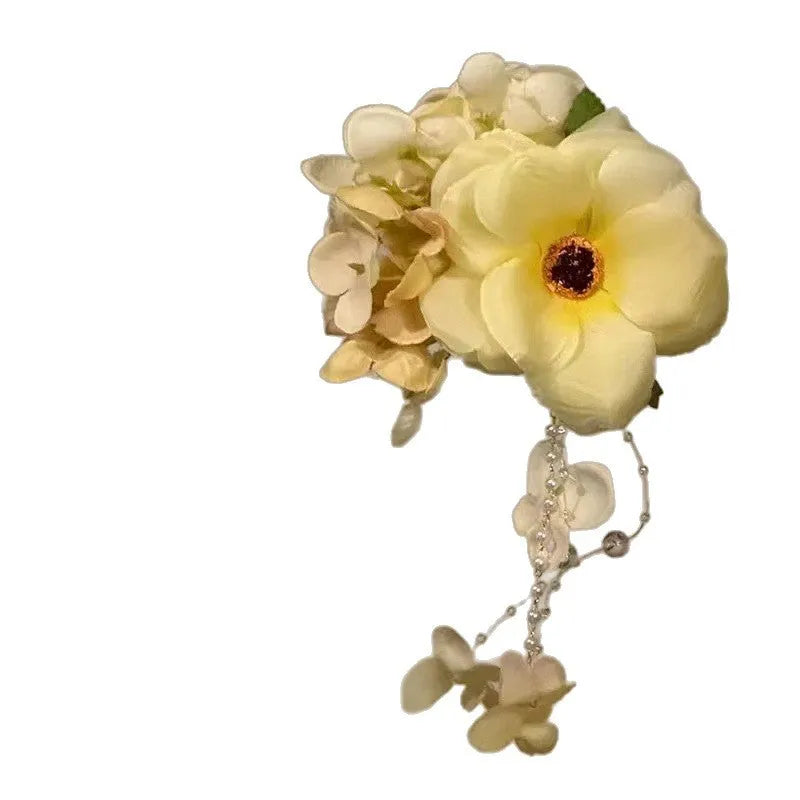 Handmade women's hairclip with flower tassels in purple or yellow colour options