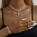 Claw chain necklace and earrings set with drop-shaped rhinestones in choice of five colours