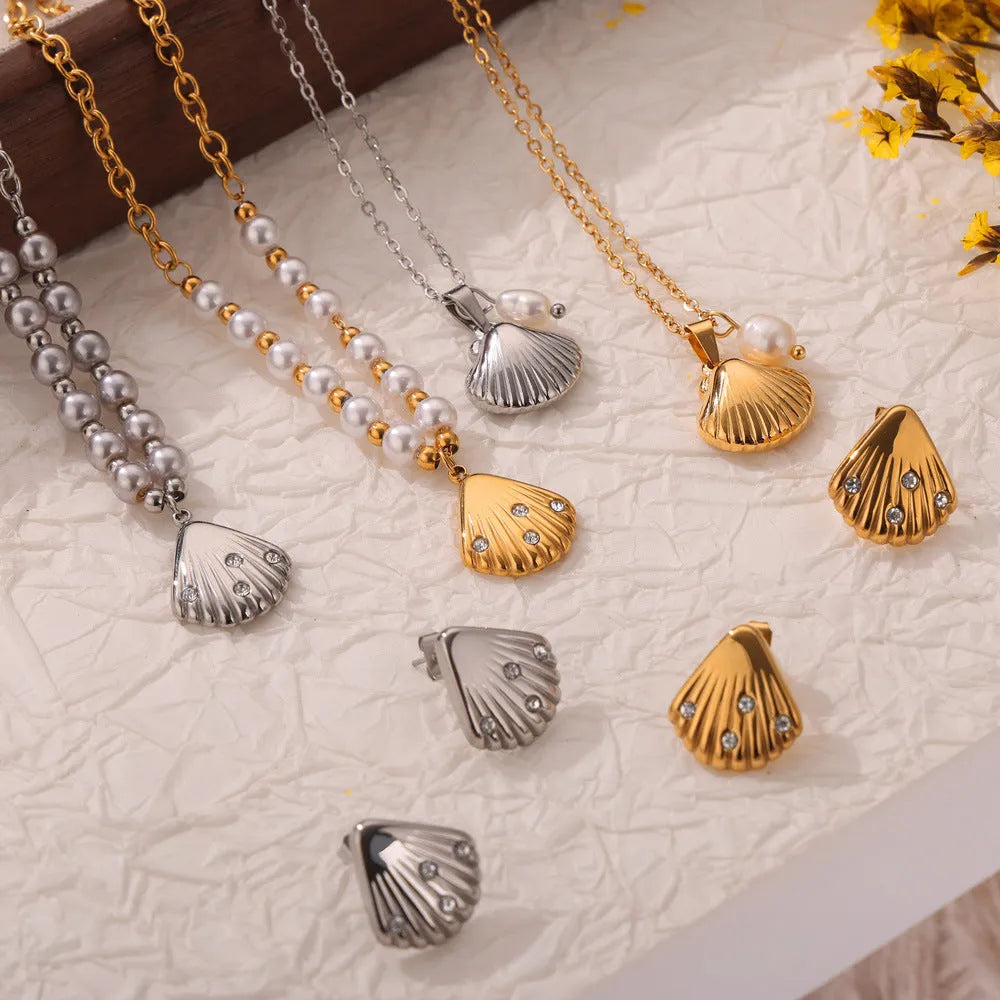 Gold titanium steel women's necklace featuring a French vintage shell pendant with freshwater pearl beads on an O-chain.